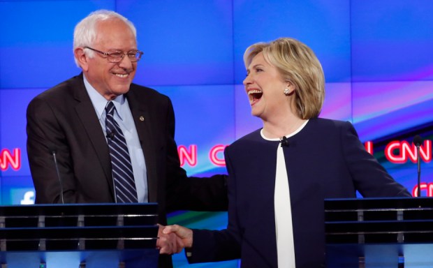 Democratic presidential candidate and former Secretary of State Clinton shakes hands with rival candidate and U.S. Senator Sanders as they participate in the first official Democratic candidates debate of the 2016 presidential campaign in Las Vegas